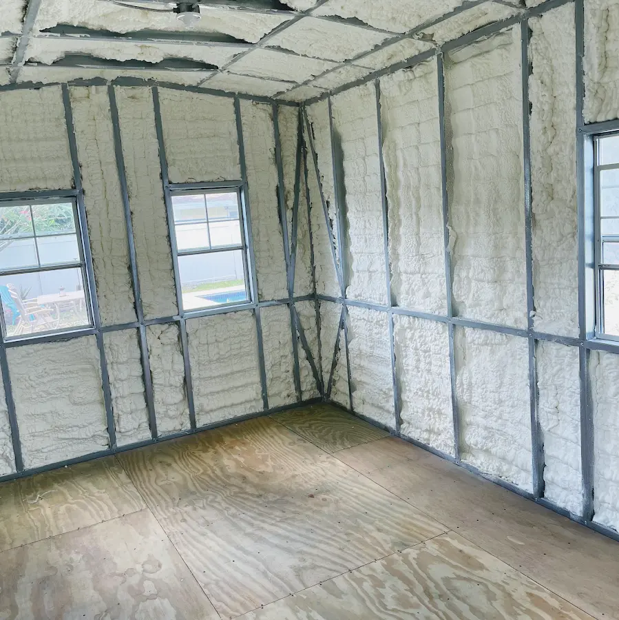 Closed-cell spray foam insulation applied to wall cavities in a residential project in Brentwood